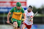 24 February 2024; Stephen Gillespie of Donegal in action against Bryan McGurk of Tyrone during the Allianz Hurling League Division 2 Group B match between Tyrone and Donegal at O'Neills Healy Park in Omagh, Tyrone. Photo by Ben McShane/Sportsfile