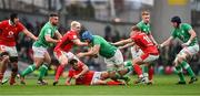 24 February 2024; Tadhg Beirne of Ireland is tackled by Wales players, from left, Aaron Wainwright, Tomos Williams and Sam Costelow during the Guinness Six Nations Rugby Championship match between Ireland and Wales at Aviva Stadium in Dublin. Photo by Ramsey Cardy/Sportsfile