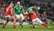 24 February 2024; Andrew Porter of Ireland is tackled by Will Rowlands of Wales during the Guinness Six Nations Rugby Championship match between Ireland and Wales at Aviva Stadium in Dublin. Photo by Ramsey Cardy/Sportsfile