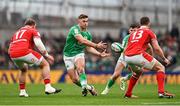 24 February 2024; Jack Crowley of Ireland in action against Corey Domachowski and George North of Wales during the Guinness Six Nations Rugby Championship match between Ireland and Wales at Aviva Stadium in Dublin. Photo by Ramsey Cardy/Sportsfile