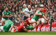 24 February 2024; Ronan Kelleher of Ireland is tackled by Dafydd Jenkins and Tommy Reffell of Wales during the Guinness Six Nations Rugby Championship match between Ireland and Wales at Aviva Stadium in Dublin. Photo by Sam Barnes/Sportsfile