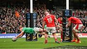 24 February 2024; Ciarán Frawley of Ireland scores his side's fourth try during the Guinness Six Nations Rugby Championship match between Ireland and Wales at Aviva Stadium in Dublin. Photo by Ramsey Cardy/Sportsfile