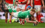 24 February 2024; Ciarán Frawley of Ireland scores his side's third try during the Guinness Six Nations Rugby Championship match between Ireland and Wales at Aviva Stadium in Dublin. Photo by Sam Barnes/Sportsfile