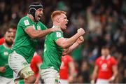 24 February 2024; Ciarán Frawley of Ireland, right, celebrates with teammate Caelan Doris after scoring their side's third try during the Guinness Six Nations Rugby Championship match between Ireland and Wales at Aviva Stadium in Dublin. Photo by Sam Barnes/Sportsfile
