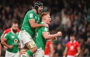 24 February 2024; Ciarán Frawley of Ireland, right, celebrates with teammate Caelan Doris after scoring their side's third try during the Guinness Six Nations Rugby Championship match between Ireland and Wales at Aviva Stadium in Dublin. Photo by Sam Barnes/Sportsfile