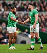 24 February 2024; Ireland centres Bundee Aki, left, and Robbie Henshaw during the Guinness Six Nations Rugby Championship match between Ireland and Wales at Aviva Stadium in Dublin. Photo by Ramsey Cardy/Sportsfile