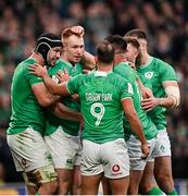 24 February 2024; Ciarán Frawley of Ireland, centre, celebrates with teammates Caelan Doris, left, and Jamison Gibson-Park and Jack Crowley after scoring their side's third try during the Guinness Six Nations Rugby Championship match between Ireland and Wales at Aviva Stadium in Dublin.  Photo by Ramsey Cardy/Sportsfile
