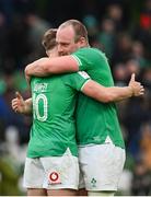 24 February 2024; Ireland players Oli Jager, right, and Jack Crowley after their side's victory during the Guinness Six Nations Rugby Championship match between Ireland and Wales at the Aviva Stadium in Dublin. Photo by Seb Daly/Sportsfile