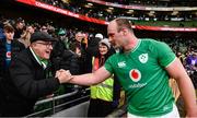 24 February 2024; Oli Jager of Ireland is congratulated by Ireland supporter Mike Higgins, who used to coach him at underage level at Naas RFC, after his side's victory in the Guinness Six Nations Rugby Championship match between Ireland and Wales at Aviva Stadium in Dublin. Photo by Sam Barnes/Sportsfile