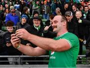 24 February 2024; Oli Jager of Ireland takes a selfie with supporters after his side's victory in the Guinness Six Nations Rugby Championship match between Ireland and Wales at Aviva Stadium in Dublin. Photo by Sam Barnes/Sportsfile