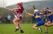 24 February 2024; Orlaith McGrath of Galway has a shot at goal despite the attempts of Clodagh McIntyre, left, and Caoimhe Maher of Tipperary during the Very Camogie League Division 1 match between Tipperary and Galway at The Ragg GAA Grounds in Tipperary. Photo by Tom Beary/Sportsfile