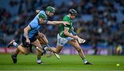 24 February 2024; Diarmaid Byrnes of Limerick in action against James Madden and Chris Crummy of Dublin during the Allianz Hurling League Division 1 Group B match between Dublin and Limerick at Croke Park in Dublin. Photo by Brendan Moran/Sportsfile