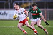 24 February 2024; Darragh Canavan of Tyrone in action against Sam Callinan of Mayo during the Allianz Football League Division 1 match between Tyrone and Mayo at O'Neills Healy Park in Omagh, Tyrone. Photo by Ben McShane/Sportsfile
