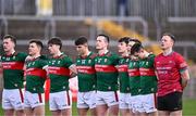 24 February 2024; Mayo players, including goalkeeper Rob Hennelly, right, stand for Amhrán na bhFiann before the Allianz Football League Division 1 match between Tyrone and Mayo at O'Neills Healy Park in Omagh, Tyrone. Photo by Ben McShane/Sportsfile