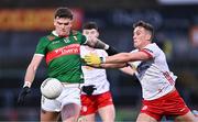 24 February 2024; Jordan Flynn of Mayo in action against Conn Kilpatrick of Tyrone during the Allianz Football League Division 1 match between Tyrone and Mayo at O'Neills Healy Park in Omagh, Tyrone. Photo by Ben McShane/Sportsfile