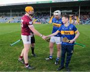 24 February 2024; Mascot Tommy Cleary from Moyne/Templetuohy, shakes hands with Westmeath captian Niall Mitchell before the Allianz Hurling League Division 1 Group B match between Tipperary and Westmeath at FBD Semple Stadium in Thurles, Tipperary. Photo by Michael P Ryan/Sportsfile