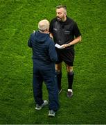 24 February 2024; Referee Kevin Jordan talks to Dublin manager Micheál Donoghue, before starting the second half, during the Allianz Hurling League Division 1 Group B match between Dublin and Limerick at Croke Park in Dublin. Photo by Ray McManus/Sportsfile