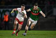 24 February 2024; Darragh Canavan of Tyrone in action against Fergal Boland of Mayo during the Allianz Football League Division 1 match between Tyrone and Mayo at O'Neills Healy Park in Omagh, Tyrone. Photo by Ben McShane/Sportsfile