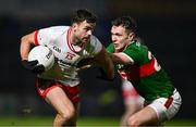 24 February 2024; Darren McCurry of Tyrone in action against Michael Plunkett of Mayo during the Allianz Football League Division 1 match between Tyrone and Mayo at O'Neills Healy Park in Omagh, Tyrone. Photo by Ben McShane/Sportsfile