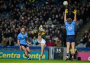 24 February 2024; Seán O'Shea of Kerry kicks a point despite the efforts of Seán MacMahon and Cian Murphy of Dublin during the Allianz Football League Division 1 match between Dublin and Kerry at Croke Park in Dublin. Photo by Brendan Moran/Sportsfile