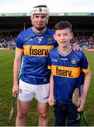 24 February 2024; Tipperary captain Seamus Kennedy with mascot Tommy Cleary from Moyne/Templetuohy before the Allianz Hurling League Division 1 Group B match between Tipperary and Westmeath at FBD Semple Stadium in Thurles, Tipperary. Photo by Michael P Ryan/Sportsfile