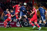24 February 2024; Cameron McJannet of Derry City has an attempt on goal despite the efforts of Nando Pijnaker of Sligo Rovers during the SSE Airtricity Men's Premier Division match between Sligo Rovers and Derry City at The Showgrounds in Sligo. Photo by Tyler Miller/Sportsfile