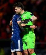 24 February 2024; Jordan McEneff of Derry City and Sligo Rovers goalkeeper Edward McGinty after the SSE Airtricity Men's Premier Division match between Sligo Rovers and Derry City at The Showgrounds in Sligo. Photo by Tyler Miller/Sportsfile