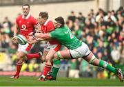 24 February 2024; Sam Costelow of Wales is tackled by Joe McCarthy of Ireland during the Guinness Six Nations Rugby Championship match between Ireland and Wales at Aviva Stadium in Dublin. Photo by Sam Barnes/Sportsfile