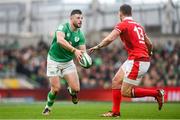 24 February 2024; Robbie Henshaw of Ireland  in action against George North of Wales during the Guinness Six Nations Rugby Championship match between Ireland and Wales at Aviva Stadium in Dublin. Photo by Sam Barnes/Sportsfile
