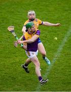 25 February 2024; Kevin Foley of Wexford in action against Seán Rynne of Clare during the Allianz Hurling League Division 1 Group A match between Wexford and Clare at Chadwicks Wexford Park in Wexford. Photo by Seb Daly/Sportsfile