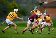 25 February 2024; Daithí Burke of Galway in action against Antrim players, from left, Fred McCurry, Niall McKenna, and Ronan McAteer during the Allianz Hurling League Division 1 Group B match between Antrim and Galway at Corrigan Park in Belfast. Photo by Tyler Miller/Sportsfile