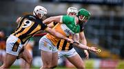 25 February 2024; Ben Conneely of Offaly is tackled by Mikey Carey of Kilkenny during the Allianz Hurling League Division 1 Group A match between Kilkenny and Offaly at UPMC Nowlan Park in Kilkenny. Photo by Ray McManus/Sportsfile