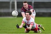 25 February 2024; Paul Cassidy of Derry in action against Daniel O’Flaherty of Galway during the Allianz Football League Division 1 match between Galway and Derry at Pearse Stadium in Galway. Photo by Ray Ryan/Sportsfile