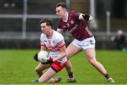 25 February 2024; Paul Cassidy of Derry in action against Daniel O’Flaherty of Galway during the Allianz Football League Division 1 match between Galway and Derry at Pearse Stadium in Galway. Photo by Ray Ryan/Sportsfile