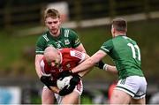 25 February 2024; Brian O'Driscoll of Cork in action against Brandon Horan, left, and Ronan Caffrey of Fermanagh during the Allianz Football League Division 2 match between Fermanagh and Cork at St Joseph’s Park in Ederney, Fermanagh. Photo by Ben McShane/Sportsfile
