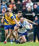 25 February 2024; Stephen O’Hanlon of Monaghan in action against Brian Stack of Roscommon during the Allianz Football League Division 1 match between Roscommon and Monaghan at Dr Hyde Park in Roscommon. Photo by Daire Brennan/Sportsfile