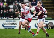 25 February 2024; Dylan McHugh of Galway in action against Paul Cassidy of Derry during the Allianz Football League Division 1 match between Galway and Derry at Pearse Stadium in Galway. Photo by Ray Ryan/Sportsfile