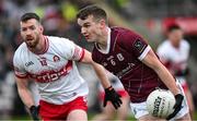 25 February 2024; John Daly of Galway in action against Niall Loughlin of Derry during the Allianz Football League Division 1 match between Galway and Derry at Pearse Stadium in Galway. Photo by Ray Ryan/Sportsfile