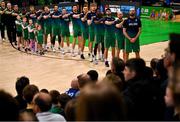 25 February 2024; The Ireland team and coaches during the national anthem before the FIBA Basketball World Cup 2027 European Pre-Qualifiers first round match between Ireland and Switzerland at the National Basketball Arena in Tallaght, Dublin. Photo by David Fitzgerald/Sportsfile
