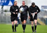 25 February 2024; Referee Brendan Griffin leaves the field at half time with linesmen Joe McQuillan, left, and David Murnane during the Allianz Football League Division 1 match between Roscommon and Monaghan at Dr Hyde Park in Roscommon. Photo by Daire Brennan/Sportsfile