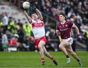 25 February 2024; Diarmuid Baker of Derry in action against Kieran Molloy of Galway during the Allianz Football League Division 1 match between Galway and Derry at Pearse Stadium in Galway. Photo by Ray Ryan/Sportsfile