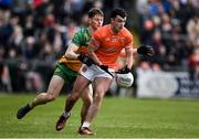 25 February 2024; Conor O'Neill of Armagh is tackled by Mark Curran of Donegal during the Allianz Football League Division 2 match between Armagh and Donegal at BOX-IT Athletic Grounds in Armagh. Photo by Brendan Moran/Sportsfile