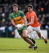 25 February 2024; Dáire O'Baoill of Donegal in action against Rory Grugan of Armagh during the Allianz Football League Division 2 match between Armagh and Donegal at BOX-IT Athletic Grounds in Armagh. Photo by Brendan Moran/Sportsfile