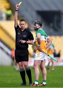 25 February 2024; Referee Thomas Gleeson shows a yellow card to Jason Sampson of Offaly during the Allianz Hurling League Division 1 Group A match between Kilkenny and Offaly at UPMC Nowlan Park in Kilkenny. Photo by Tom Beary/Sportsfile