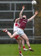 25 February 2024; Johnny Heaney of Galway in action against Conor McCluskey of Derry during the Allianz Football League Division 1 match between Galway and Derry at Pearse Stadium in Galway. Photo by Ray Ryan/Sportsfile