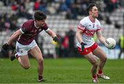 25 February 2024; Conor McCluskey of Derry in action against Sean Kelly of Galway during the Allianz Football League Division 1 match between Galway and Derry at Pearse Stadium in Galway. Photo by Ray Ryan/Sportsfile