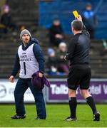 25 February 2024; Wexford Maor Uisce Des Mythen is shown a yellow card by referee Thomas Walsh during the Allianz Hurling League Division 1 Group A match between Wexford and Clare at Chadwicks Wexford Park in Wexford. Photo by Seb Daly/Sportsfile
