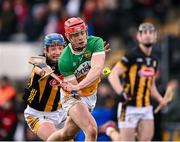 25 February 2024; Charlie Mitchell of Offaly is hooked by John Donnelly of Kilkenny during the Allianz Hurling League Division 1 Group A match between Kilkenny and Offaly at UPMC Nowlan Park in Kilkenny. Photo by Ray McManus/Sportsfile