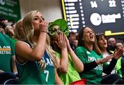 25 February 2024; Ireland supporters Jordan, centre, and Danielle Kavanagh react during the FIBA Basketball World Cup 2027 European Pre-Qualifiers first round match between Ireland and Switzerland at the National Basketball Arena in Tallaght, Dublin. Photo by David Fitzgerald/Sportsfile