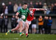 25 February 2024; Shane McGullion of Fermanagh in action against Luke Fahy of Cork during the Allianz Football League Division 2 match between Fermanagh and Cork at St Joseph’s Park in Ederney, Fermanagh. Photo by Ben McShane/Sportsfile